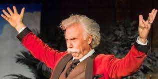Photo of an actor portraying Mark Twain in a performance